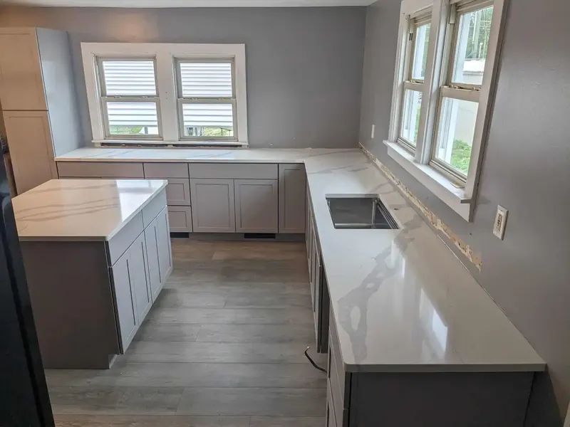 Sleek black quartz countertop with waterfall edge